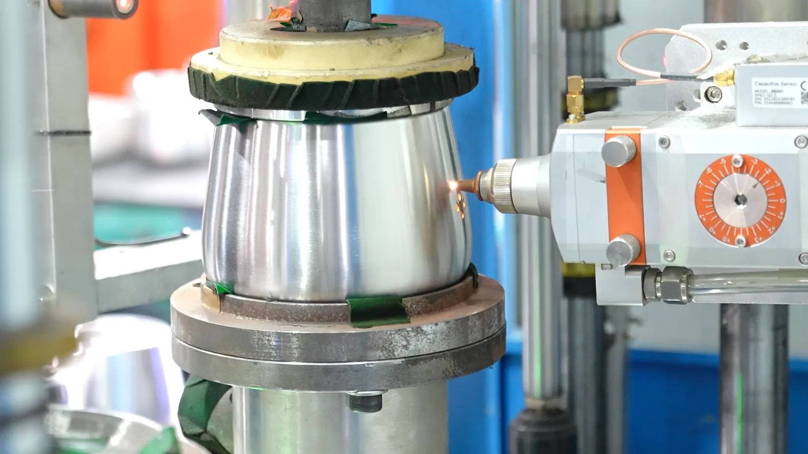 Kettle body being brazed on a rotating fixture — a process question only the factory that runs the line can answer