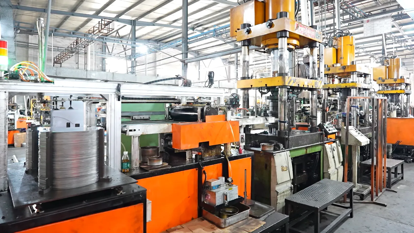 Automated stamping line forming stainless steel cookware bodies — owned production capacity a trading company cannot show